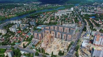 New architectural buildings in the downtown. Panoramic view of a city with a construction site of a modern district. Aerial view. video