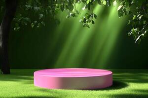 A pink round table in the middle of a green field photo