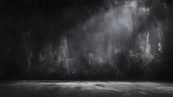 An empty room with a dark wall and floor photo