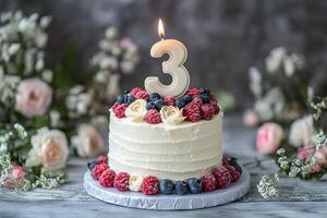 A birthday cake with a number three candle on top photo