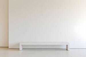 A white bench in front of a wall photo