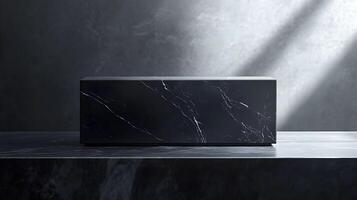 A black box sitting on a table in front of a wall photo