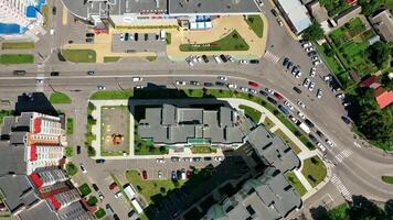 Modern city. Urban district with architecture and road filled with moving cars. View from above. Motion camera top down. video