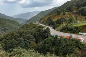 Scenic landscape view of Gilan Province in Iran featuring winding road and mountainous terrain. photo