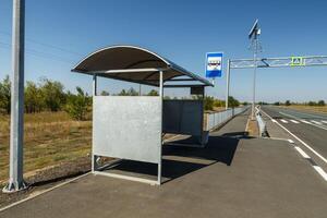empty bus stop on the road, bus stop photo