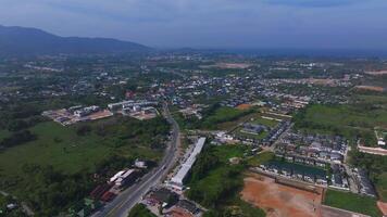 Aerial View of Phuket Island with Mountains, Roads, and Green Fields video
