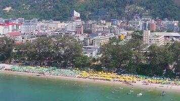 Aerial View of Patong Beach with Visitors and Urban Backdrop in Phuket video