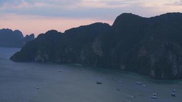 Aerial View of Phi Phi Island at Sunset with Limestone Cliffs and Boats video