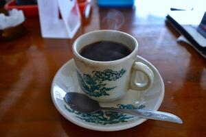 A cup of black coffee ready to drink photo