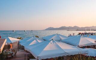 Canness seaside view over beach with umbrellas photo