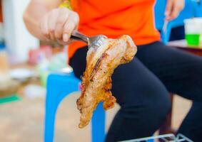 streaky pork on barbecue gril photo