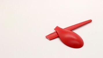 Broken red plastic spoon isolated-8 photo