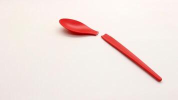 Broken red plastic spoon isolated-2 photo