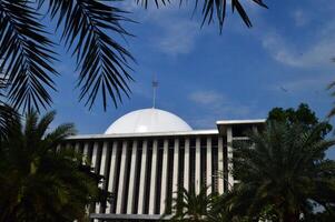 14 April 2024, View of the Istiqlal Mosque from below with shady trees photo