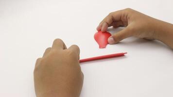 Hand holding a broken red plastic spoon-8 photo