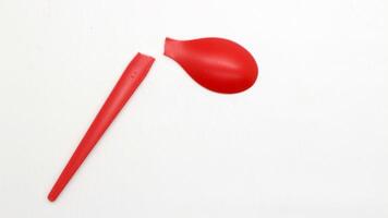 Broken red plastic spoon isolated-11 photo