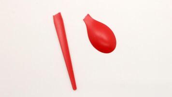 Broken red plastic spoon isolated-5 photo