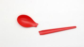 Broken red plastic spoon isolated-10 photo