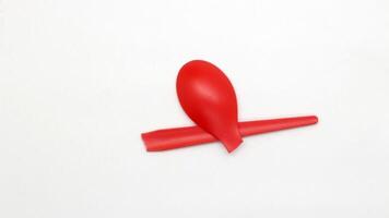 Broken red plastic spoon isolated-6 photo