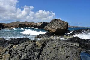 Large Waves at the Black Sand Beach in Aruba photo
