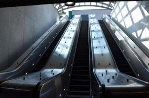 Trio of Rising Escalators at a Subway Station photo