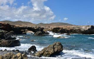 Natural Rock Bridge at Black Sand Beach photo