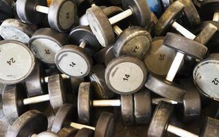 Dumbbells in modern sports club. photo