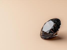 Close up of a black diamond on a beige background photo