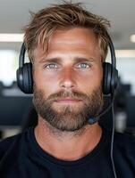 Portrait of a man wearing a headset in an office photo
