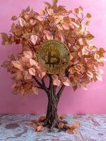 Golden Bitcoin on a tree, growing on a circuit board background photo