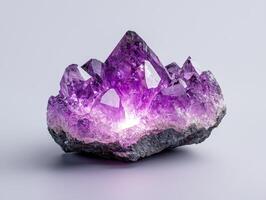 Amethyst Geode Cluster on Grey Background photo