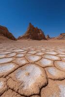Salt flats and rock formations in a desert landscape photo