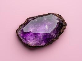 Amethyst Geode with Ornate Gold Frame on Pink Background photo
