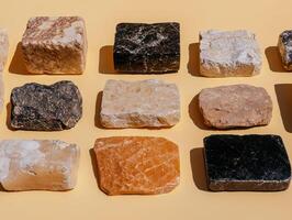 Collection of various colorful stone samples on beige background photo