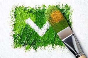 Green Checkmark Symbol with Paintbrush on Textured Canvas - Creativity and Art Concept photo