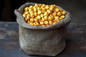 Burlap Sack Filled with Shiny Gold Nuggets for Wealth and Investment Concepts photo