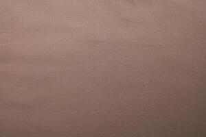 Brown cotton fabric texture. Simple brown background for background. photo