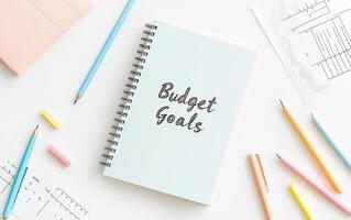 Budget Goals journal on clean workspace with colorful stationery, inspiring organization and planning photo