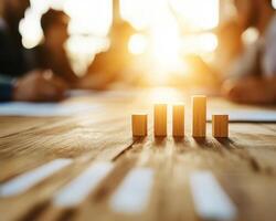 Wooden blocks representing growth in financial analysis during meeting photo