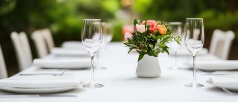 beautifully set dining table with elegant glassware and floral centerpiece, perfect for welcoming dinner photo