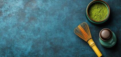 Abstract arrangement of matcha whisk and green powder on textured surface, creating serene atmosphere with ample copy space photo