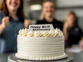 Happy Work Anniversary cake with smiling employees celebrating joyfully photo