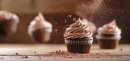 Delicious chocolate cupcakes being dusted with cocoa powder, creating delightful scene of sweetness and indulgence photo