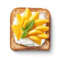 Toasted bread topped with creamy yogurt and fresh mango slices, garnished with mint photo