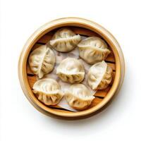 Steaming dumplings in bamboo steamer, showcasing their delicate texture and shape photo
