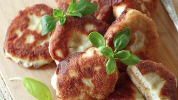 cooked fried pea pies on a wooden board video