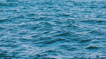 Beautiful seascape. Waves moving on the water at storm. Blue ocean water background. Slow motion. video