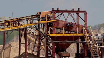Stone crusher plant machine. Conveyor belt in work process. Transportation and separation of gravel pebbles. Quarry equipment for production of building materials. video