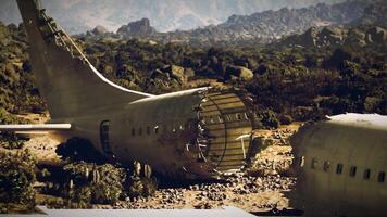 Plane crash site in rugged terrain with wreckage exposed under sunlight video