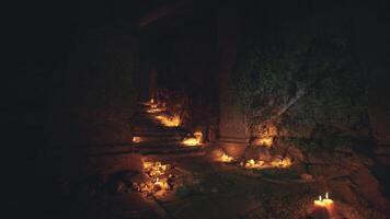 Victorian staircase illuminated by the soft glow of candles in a dark corridor video